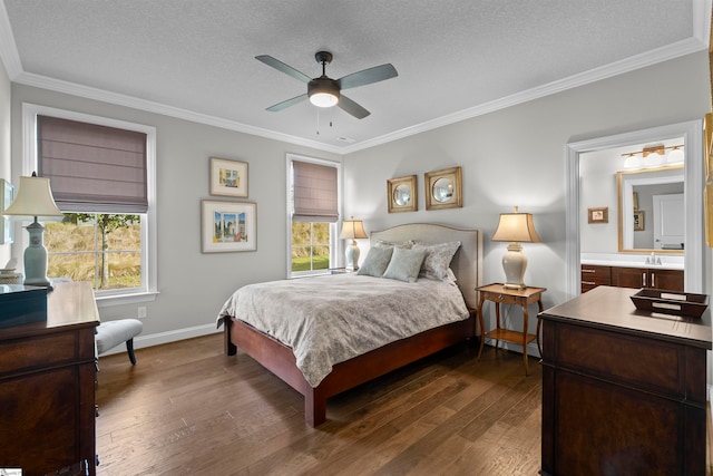 bedroom featuring ensuite bath, ceiling fan, a textured ceiling, crown molding, and dark hardwood / wood-style flooring