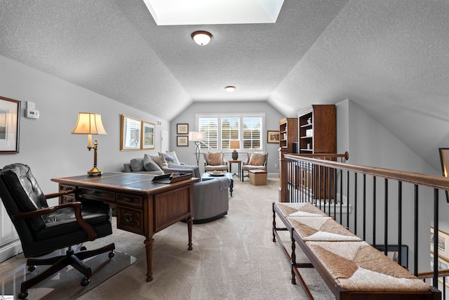 office featuring a textured ceiling, light carpet, and vaulted ceiling