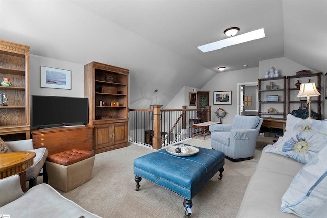 living room featuring light colored carpet and lofted ceiling with skylight