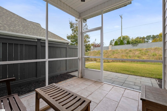 unfurnished sunroom featuring wood ceiling