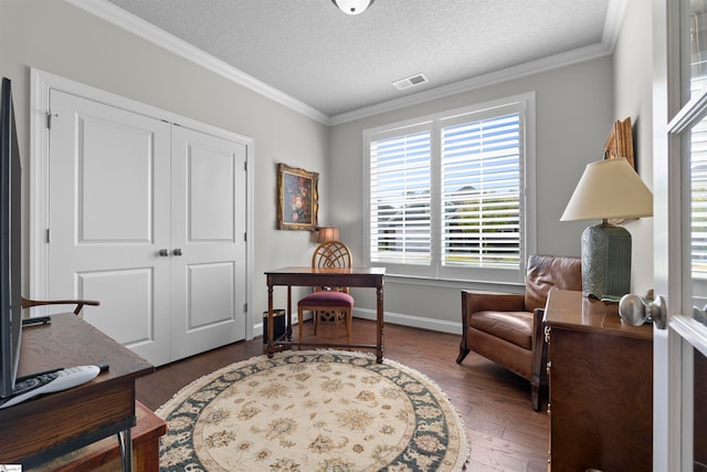 sitting room featuring ornamental molding, dark hardwood / wood-style flooring, and a textured ceiling