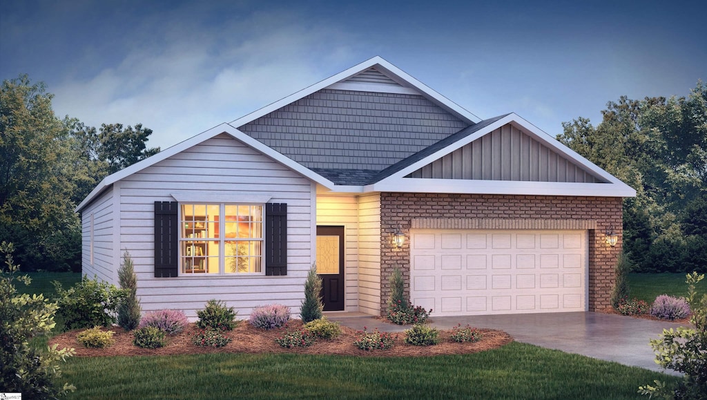 view of front facade featuring a garage and a front lawn