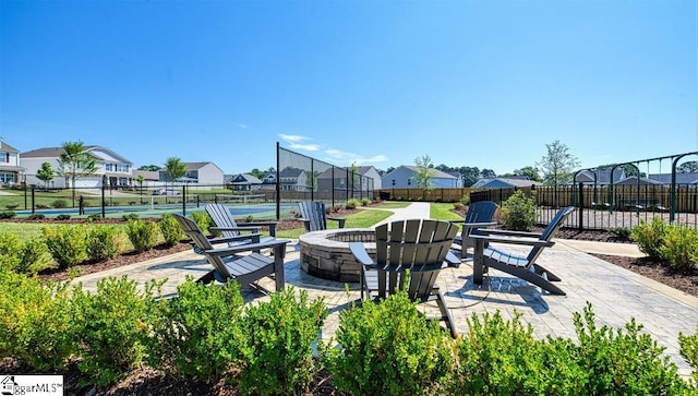 exterior space featuring a patio and a fire pit