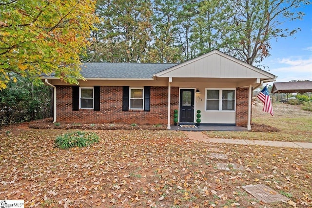 single story home with a porch