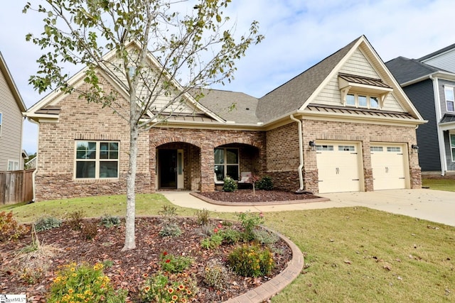 craftsman-style home with a front lawn and a garage