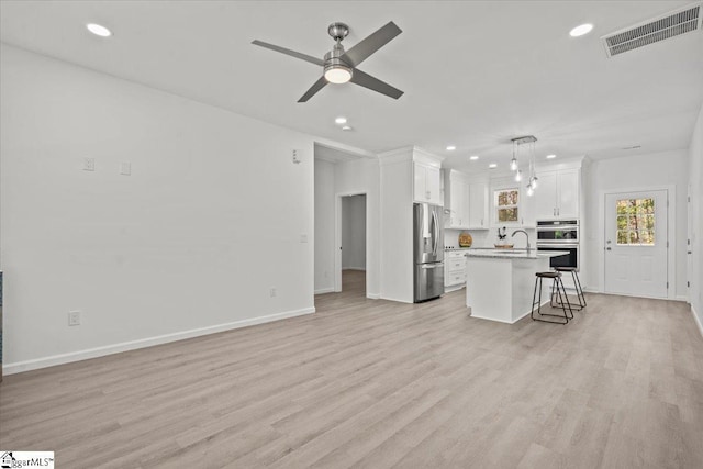 425 Tiger Ln, Westminster, SC 29693 - unfurnished living room featuring recessed lighting, ceiling fan, light wood-style flooring, a sink, and baseboards