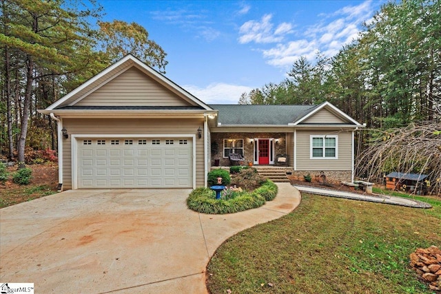 view of front of property with a garage and a front yard