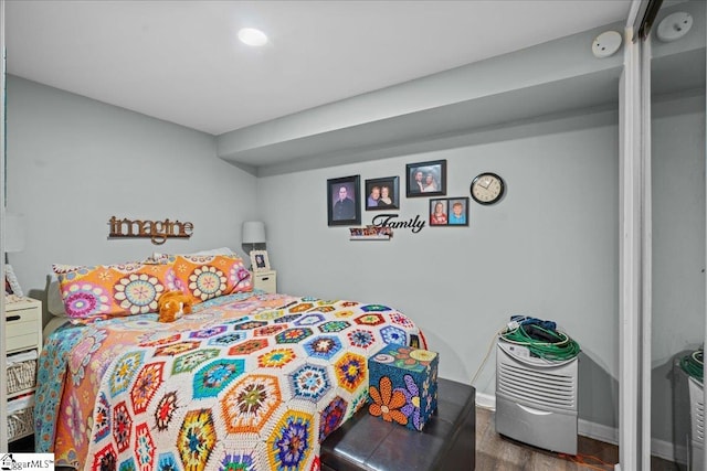 bedroom with wood-type flooring