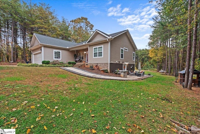 view of front of property with a garage and a front yard