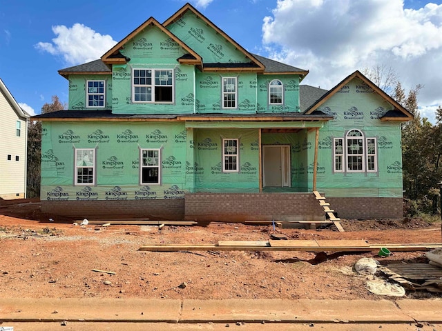 property in mid-construction with covered porch