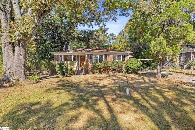 ranch-style house with a front yard