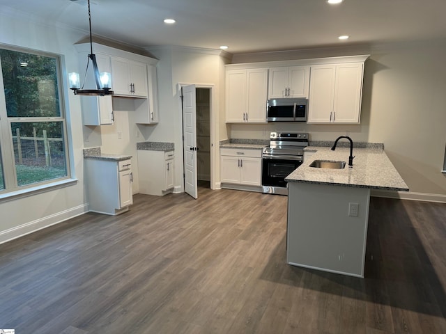 kitchen featuring kitchen peninsula, white cabinetry, sink, and appliances with stainless steel finishes