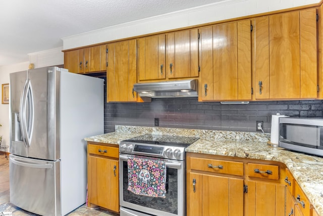 kitchen featuring stainless steel appliances, light stone counters, crown molding, and backsplash