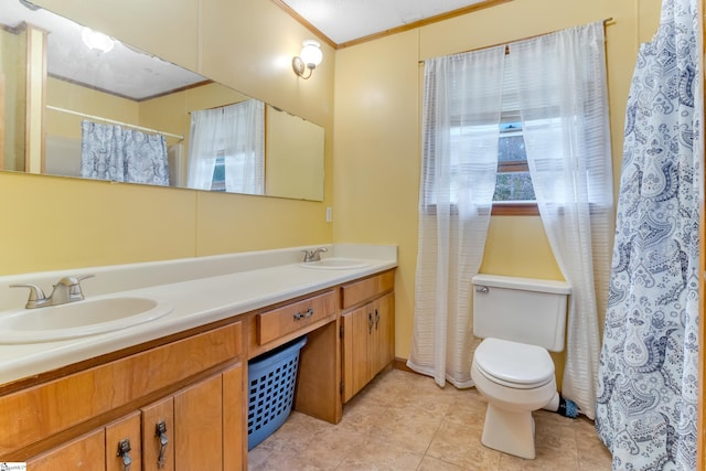 bathroom with tile patterned flooring, vanity, toilet, and ornamental molding