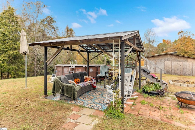 view of patio with a fire pit and a gazebo