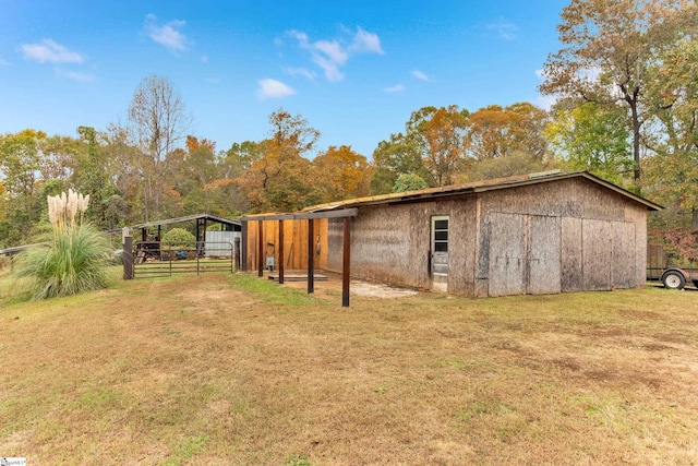 view of outbuilding with a lawn