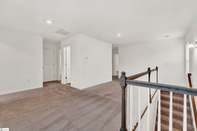 hallway featuring carpet