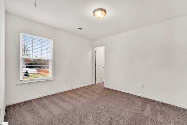 empty room featuring carpet floors