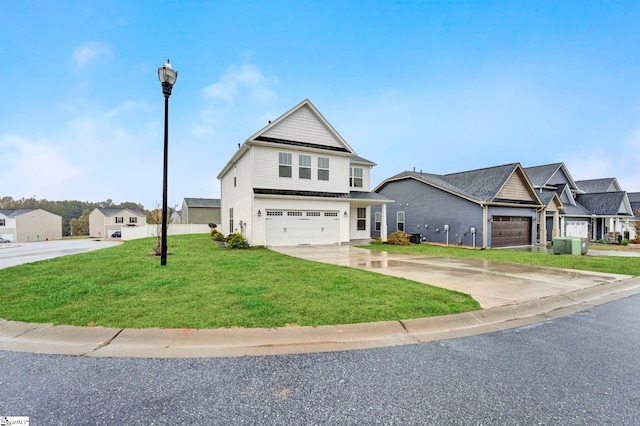 view of front of house featuring a front yard and a garage