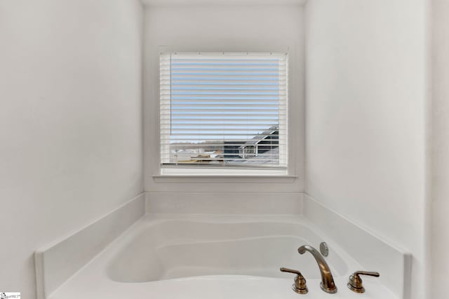 bathroom featuring a tub