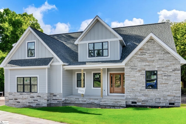 view of front of house featuring a front yard and a porch