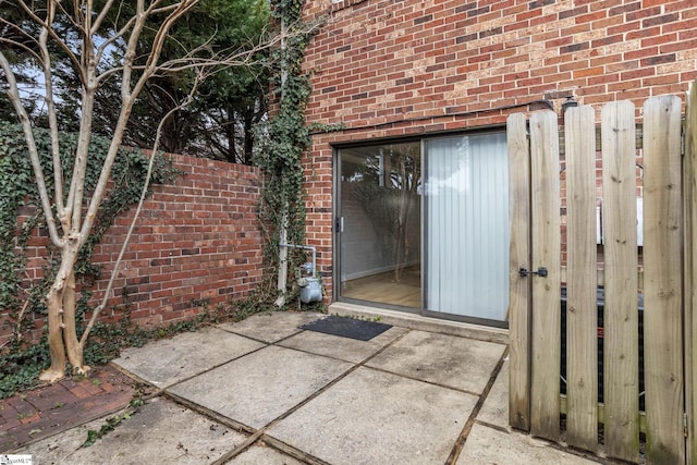 property entrance featuring a patio