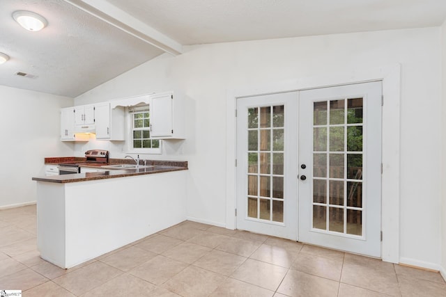 kitchen with electric range, french doors, vaulted ceiling with beams, kitchen peninsula, and white cabinets