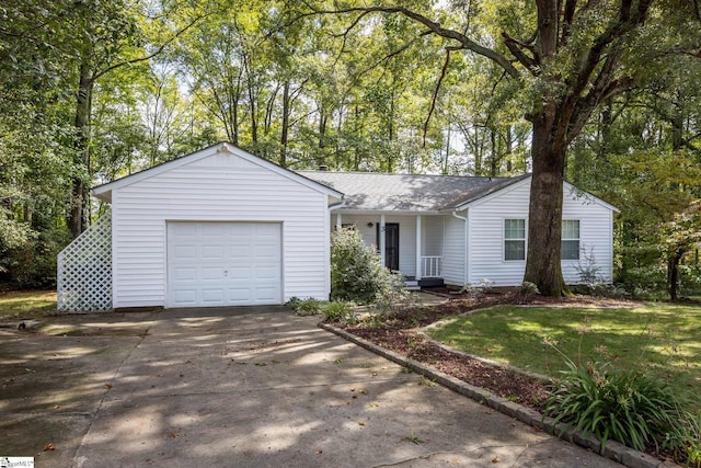 ranch-style home with a garage and a front yard