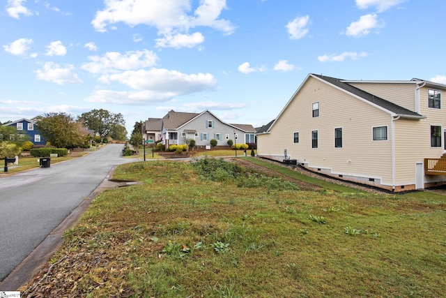 view of property exterior with a yard