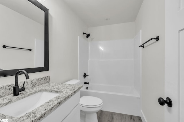 full bathroom featuring toilet, shower / tub combination, vanity, and hardwood / wood-style flooring