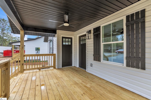 wooden terrace featuring ceiling fan