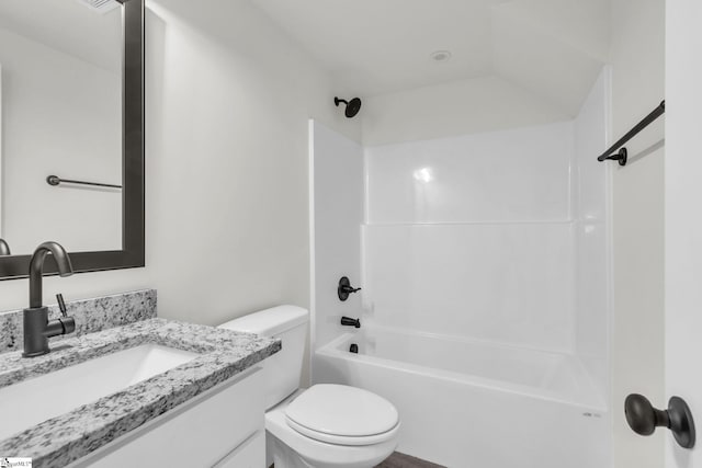 full bathroom featuring  shower combination, vanity, and toilet