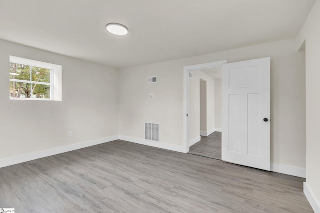 empty room with wood-type flooring