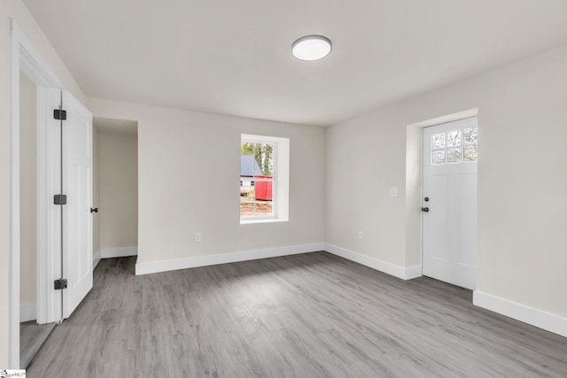 unfurnished room featuring light hardwood / wood-style flooring