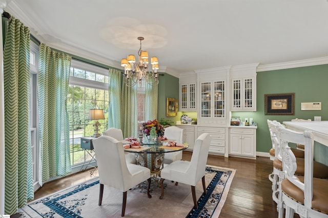 dining space featuring ornamental molding, dark hardwood / wood-style flooring, and an inviting chandelier