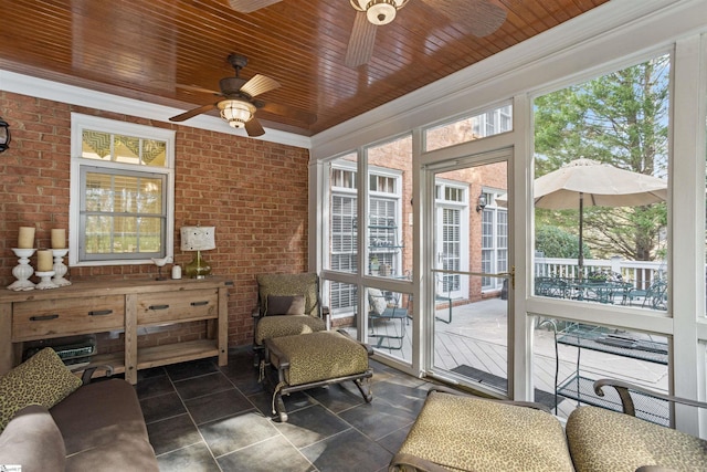 sunroom with wood ceiling and ceiling fan