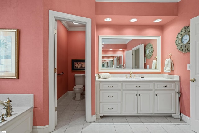 bathroom with a tub, ornamental molding, vanity, tile patterned floors, and toilet