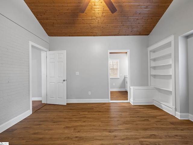 empty room with dark hardwood / wood-style floors, ceiling fan, vaulted ceiling, and wooden ceiling