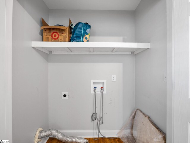 laundry room featuring electric dryer hookup, hookup for a washing machine, and wood-type flooring