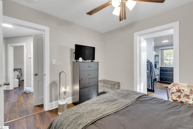 bedroom featuring ceiling fan and dark hardwood / wood-style floors