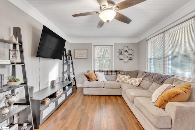 living room with light hardwood / wood-style floors, ceiling fan, crown molding, and wood ceiling