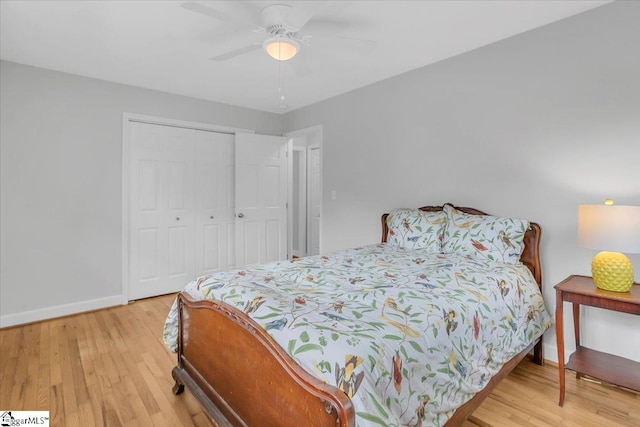 bedroom featuring a closet, hardwood / wood-style floors, and ceiling fan