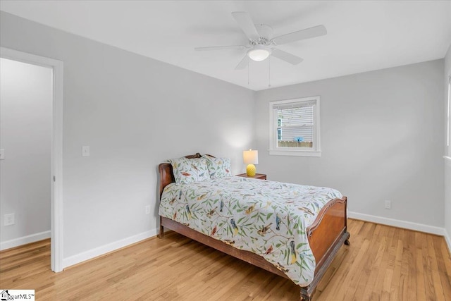 bedroom featuring light hardwood / wood-style floors and ceiling fan