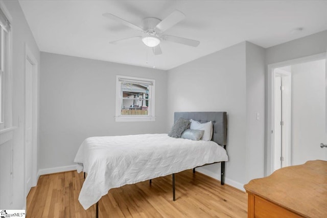 bedroom featuring ceiling fan and light hardwood / wood-style floors