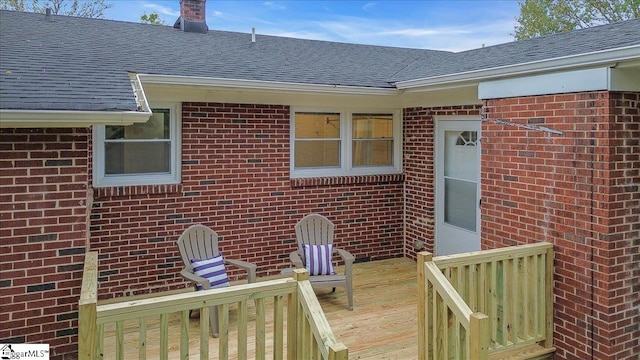 doorway to property featuring a wooden deck