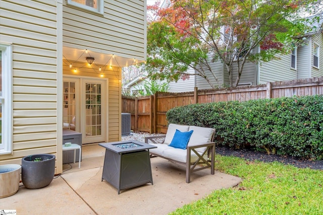 view of patio featuring a fire pit and central AC