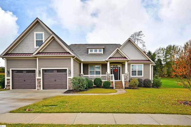 craftsman house with a front lawn and a porch