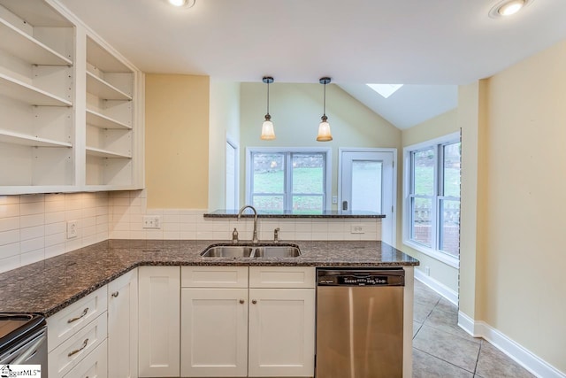 kitchen with plenty of natural light, white cabinetry, sink, and stainless steel appliances