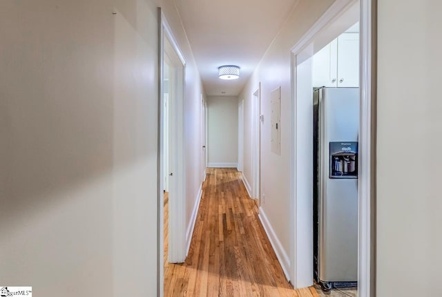 hall with light hardwood / wood-style flooring