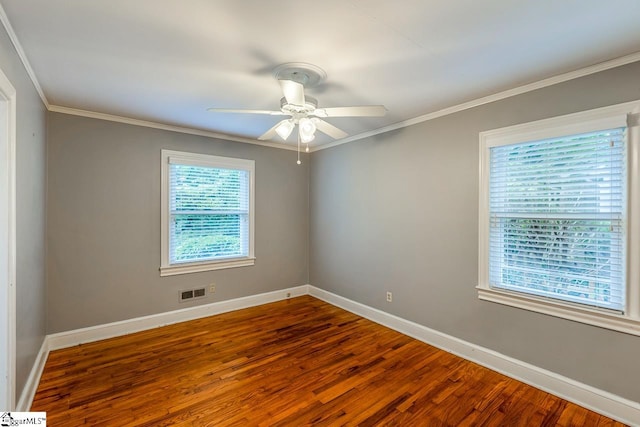 unfurnished room with ceiling fan, wood-type flooring, and ornamental molding